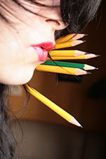 Pencils Behind a Woman's Face