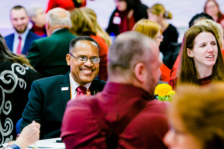 employees sitting at a table talking