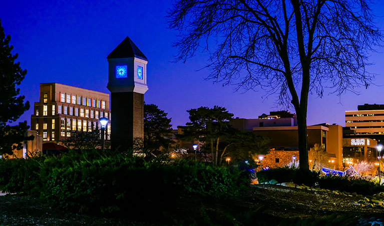 granger clock tower in the distance at night