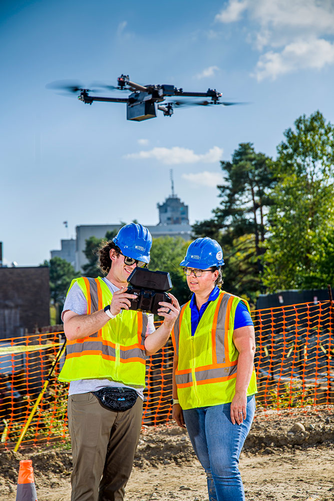 students using drones at an outdoor practice setting