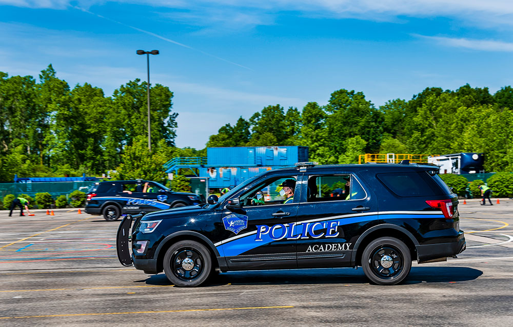 police car driving in a parking lot during training
