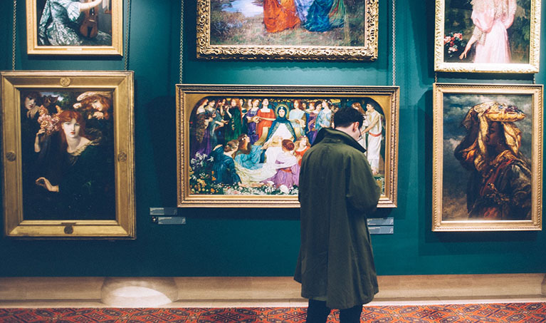 stock photo of man looking in an art gallery