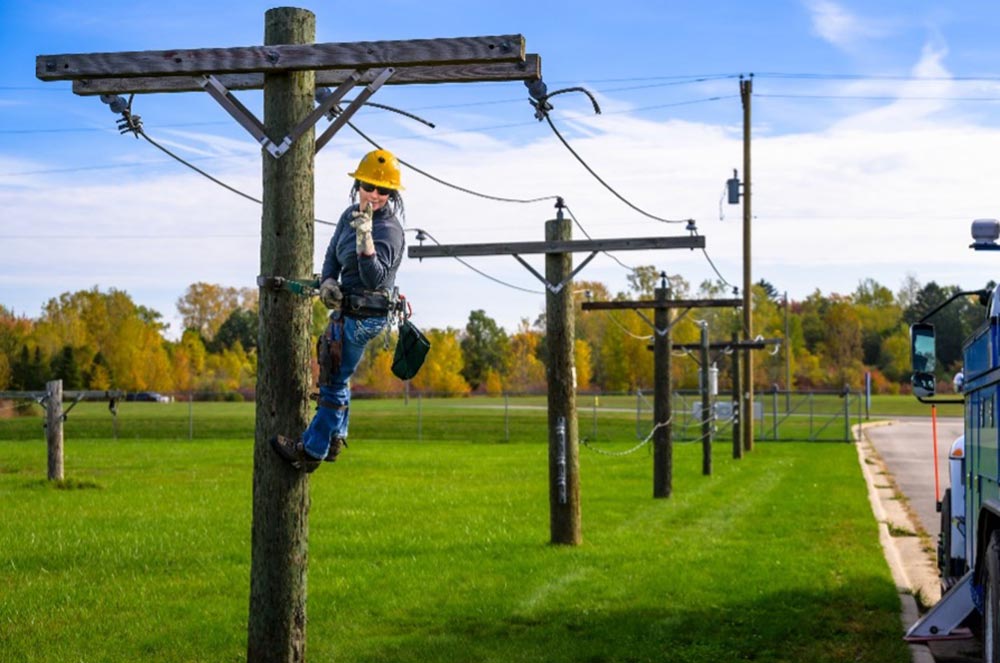 student up on one of the lcc training utility poles at west campus