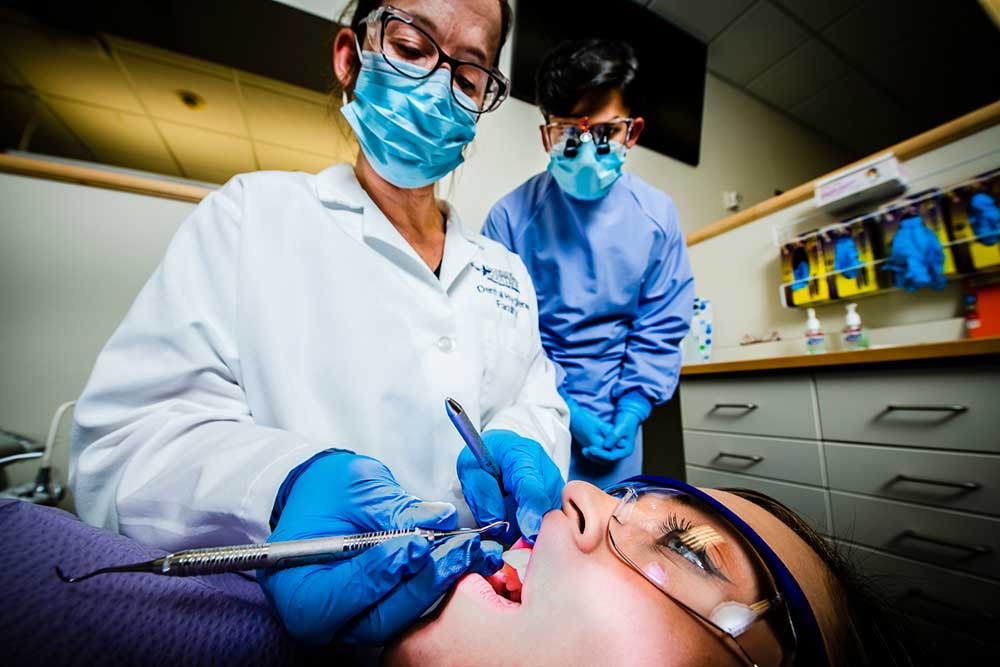 Person having their teeth checked at the dental hygiene clinic