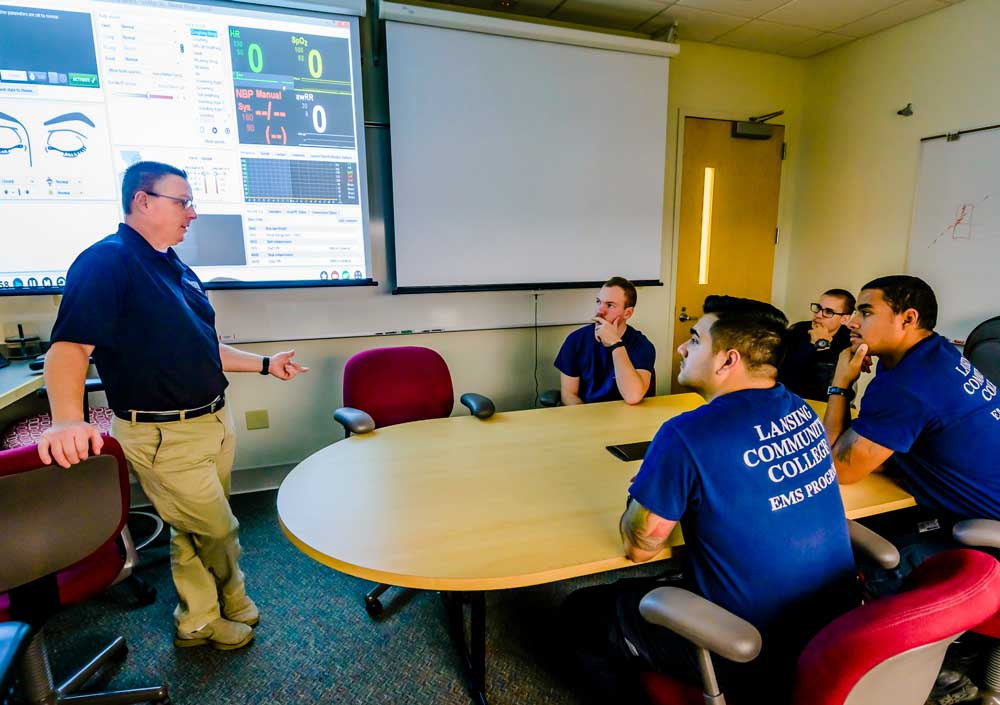Instructor teaching a group of EMS students