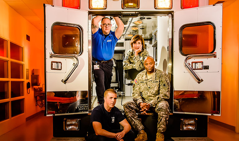 paramedics in the back of an ambulance