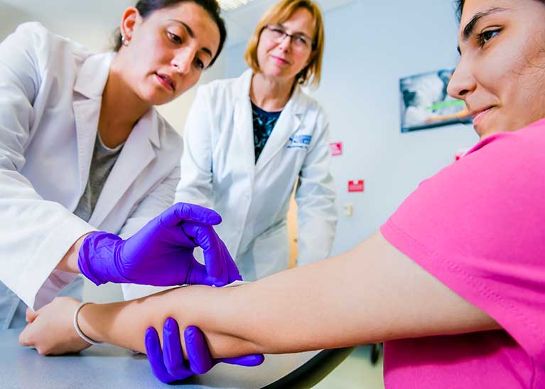 Phlebotomist drawing blood