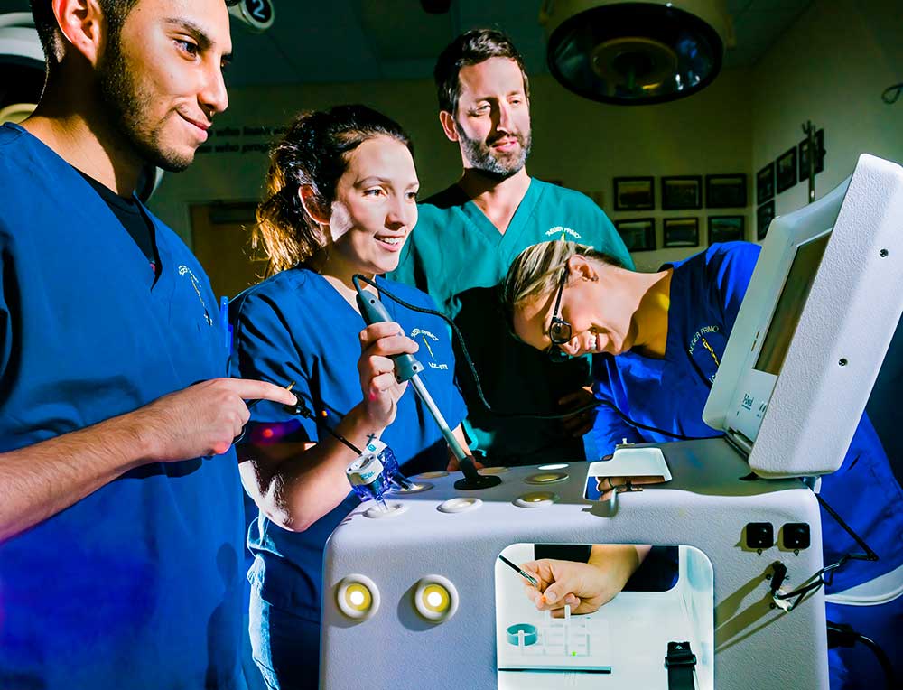 Students demonstrating a surgical procedure