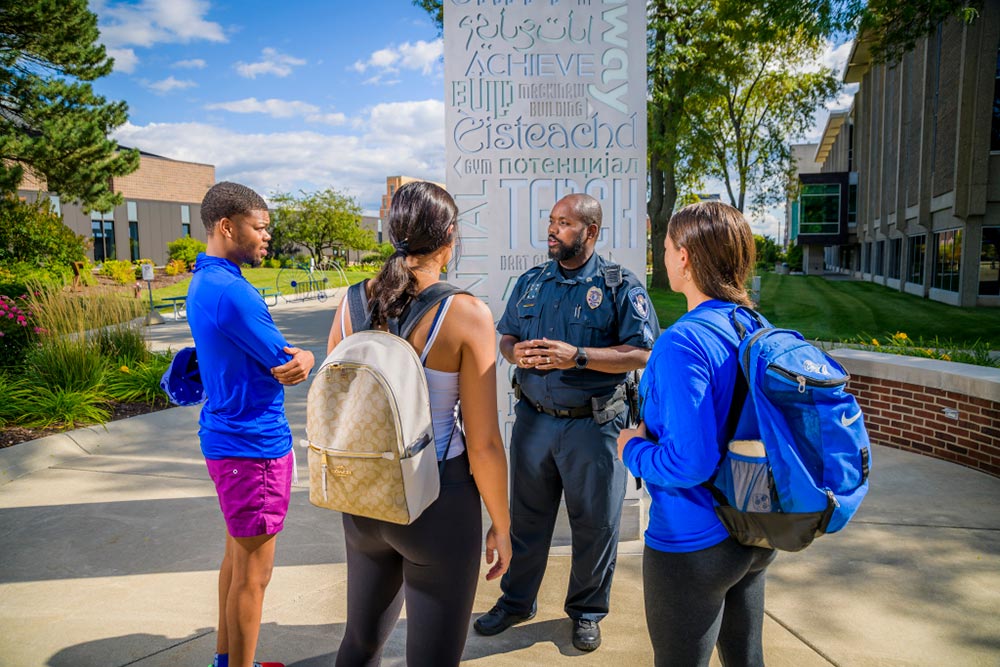 Campus officer talking to students