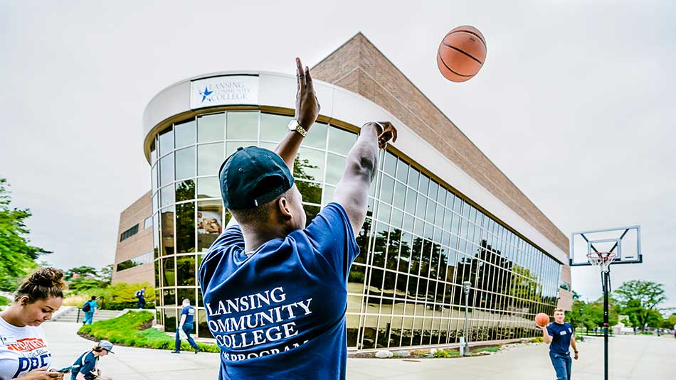Students play basketball outside of the HHS building