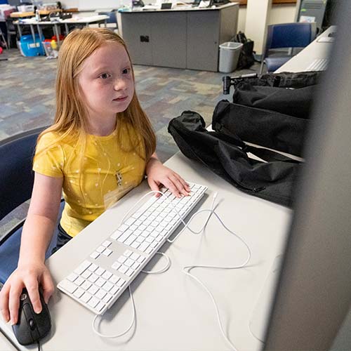 Student looking at a computer