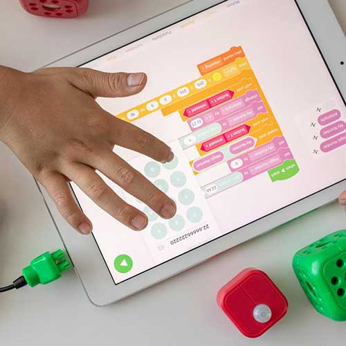 Student hands writing code