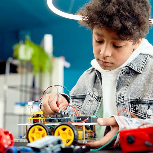 Student working with robotic car
