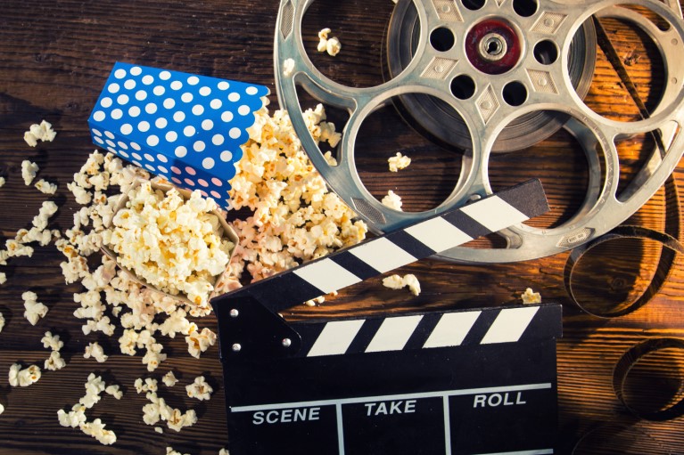 A real, movie clack board and popcorn