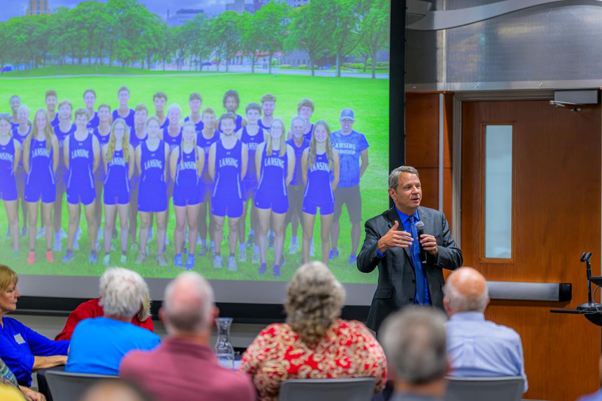 Presenter at the front of the room