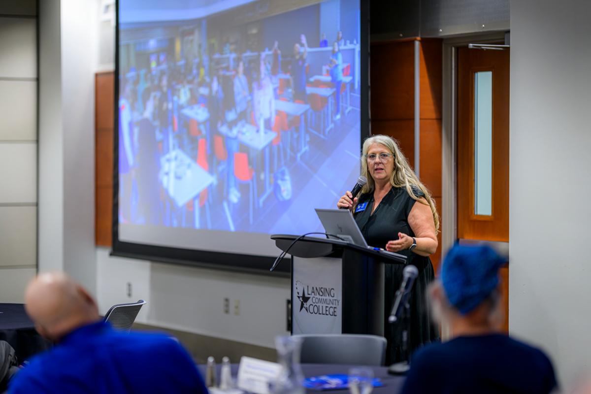 Presenter at the front of the room