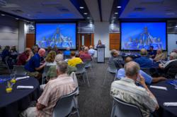 Presenter at the front of the room