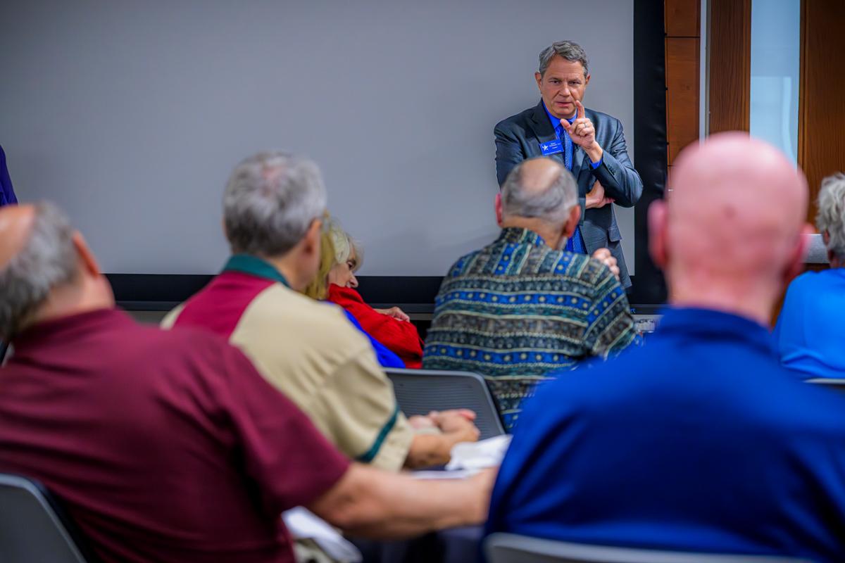 Presenter at the front of the room