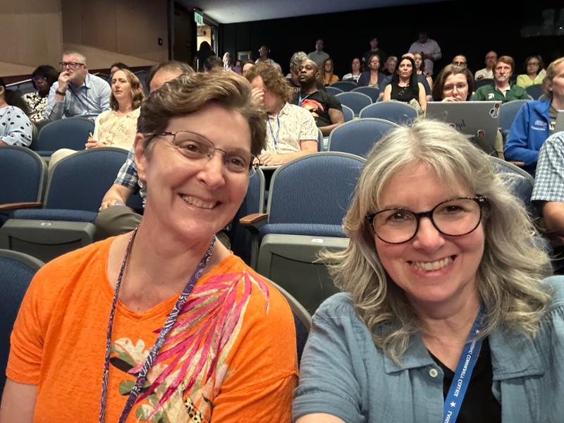 amy park doing a selfie with another womean in the dart auditorium