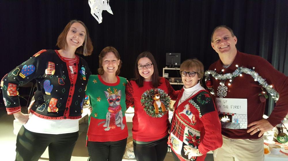 Anita Lees with an ugly sweater on along with others