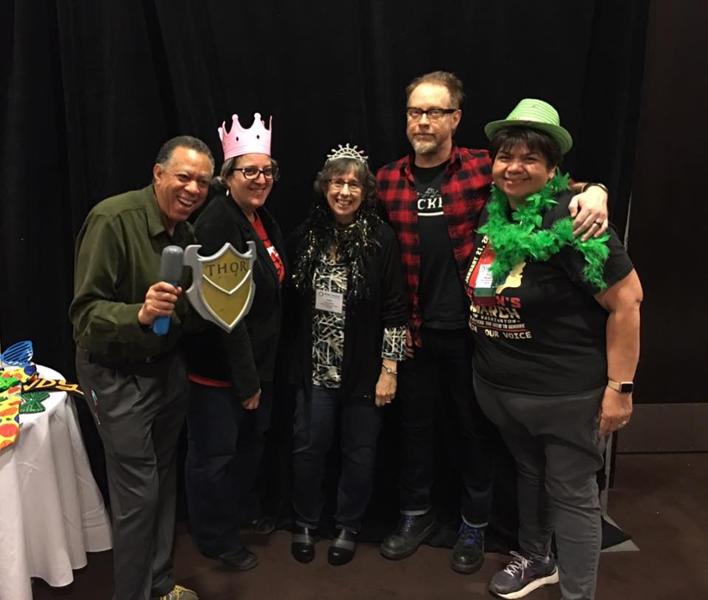 Eva Menefee with others at a conference