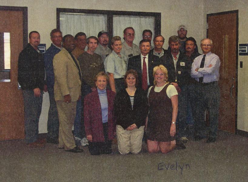 Evelyn Lynn with a large group of coworkers in 2002