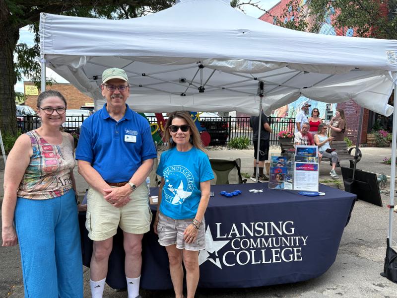 Mark Khol with two other LCC employees at an info table on campus
