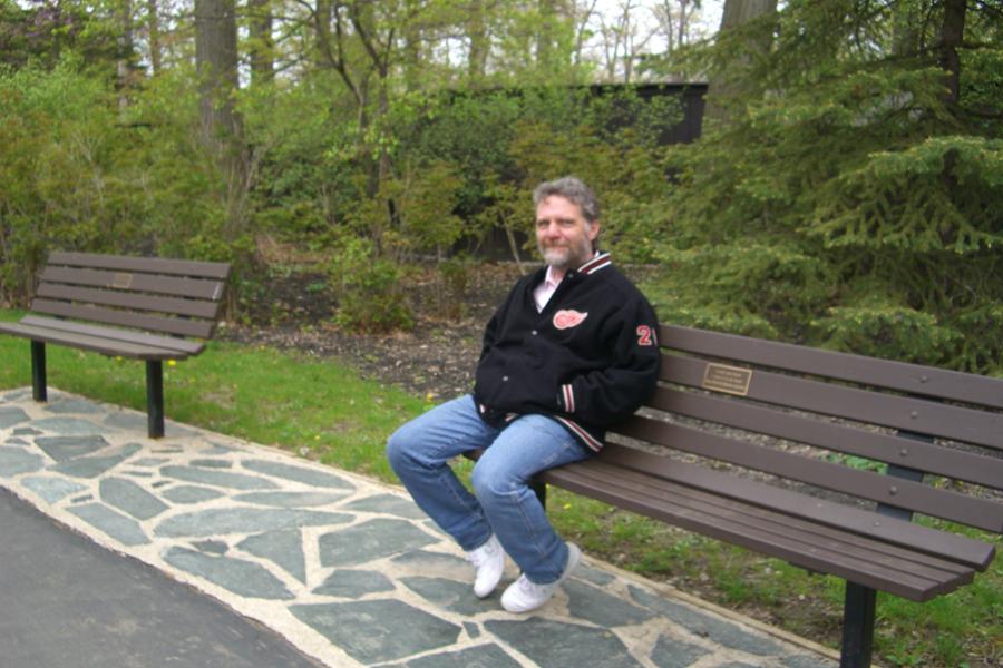 richard nelson sitting on a park bench