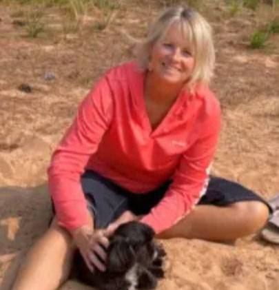 wendy prince with her dog on the beach