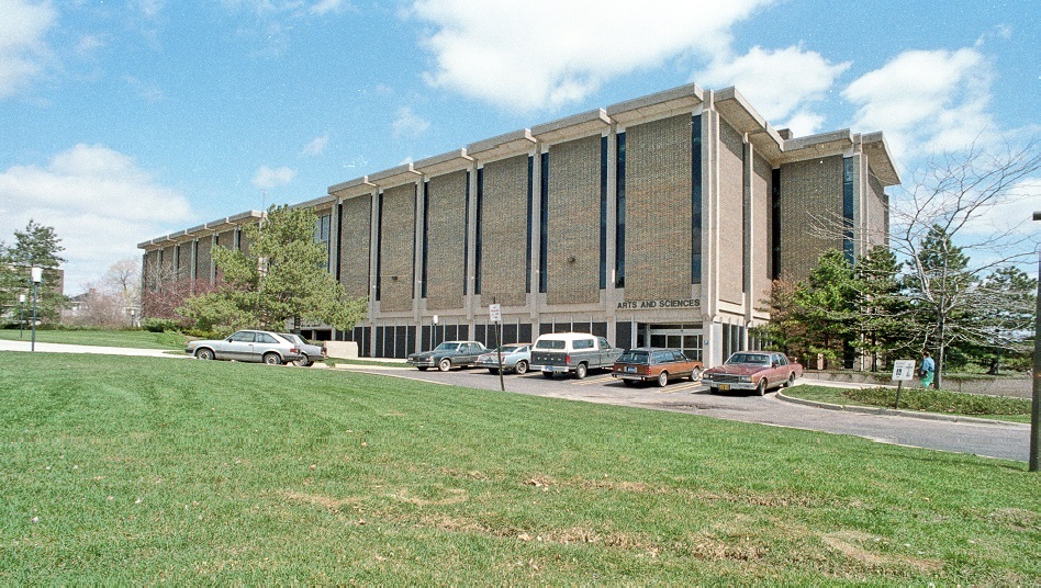 The west side of the Arts and Sciences Building and an open green space where the TLC building now stands - ca. 1980-1998