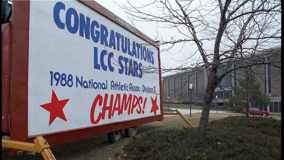 A billboard at the northeast corner of Shiawassee Street and Capitol Avenue (the current site of the TLC building) congratulating the 1988 Men's Basketball team on their NAA Division II Championship - 1988