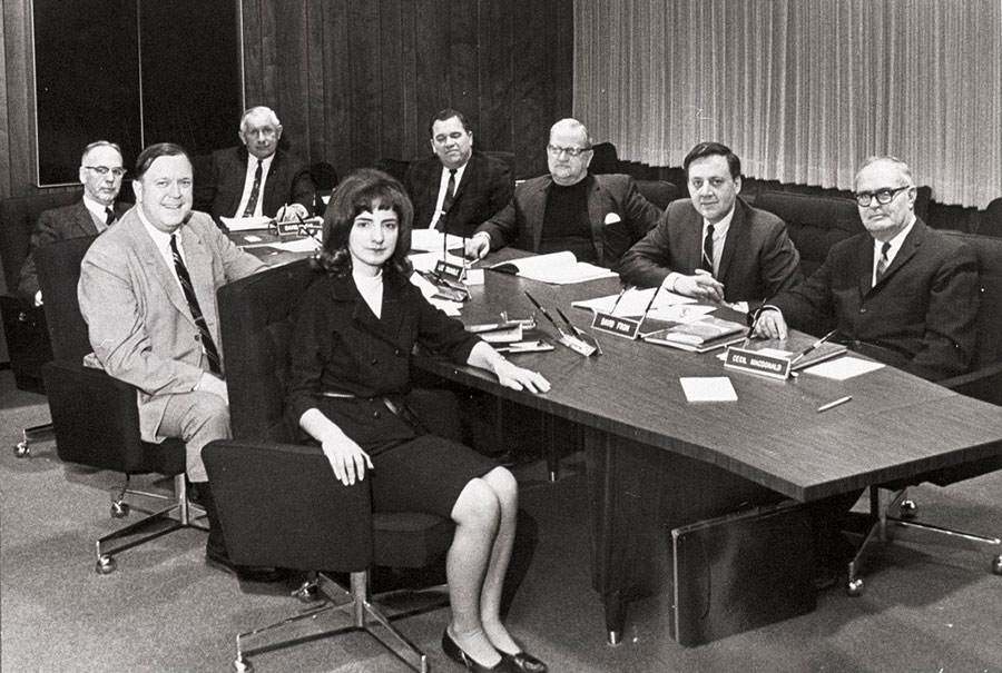 'The Board of Trustess meet with President Gannon - ca. 1967-1969. Pictured counter clock-wise from right are Cecil MacDonald, David Froh, Lee Trumble, President Philip Gannon, David Diehl, Albert Boyd, John Dart and Marilyn Wagner.