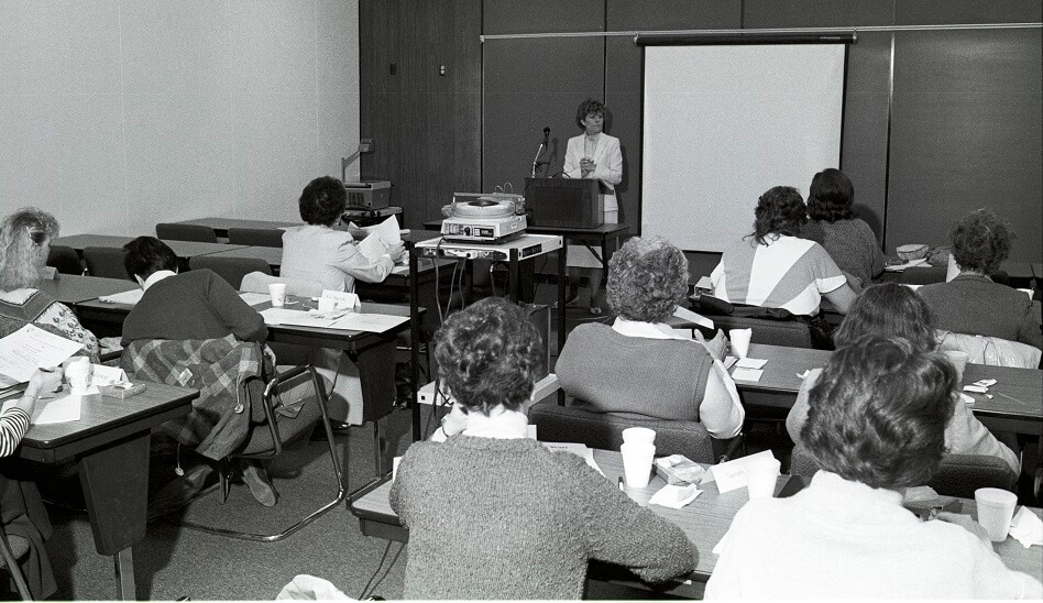 An Instructor is ready to present in a classroom - ca. 1980s