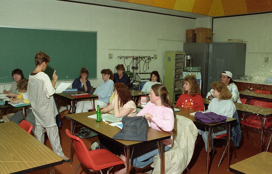 Students listen to instructor in class - ca. 1980s