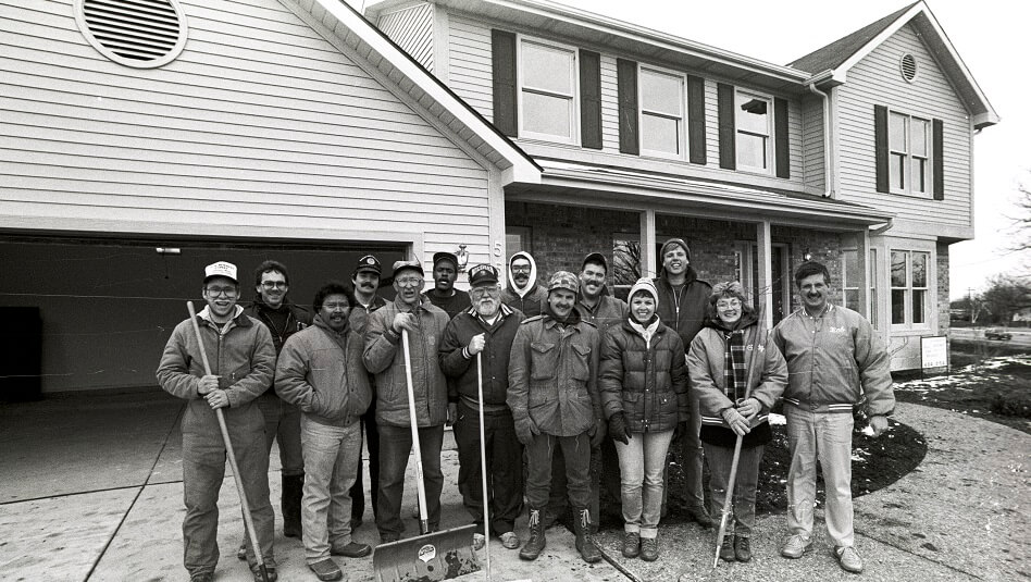 Volunteers stand outside the WKAR Dream Home Auction home - 1989