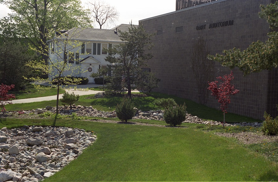 The green space north of Dart Auditorium, which is now the Shigematsu Memorial Garden. The Turner House, in the background, housed the Theatre department before the Dart Auditorium was constructed in 1980. Image ca. 1980-2000