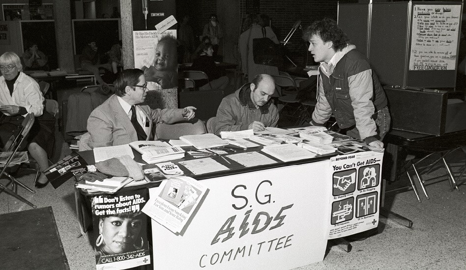 The S.G. AIDS Committee's table at the Campus Community Organizations event in the Arts and Sciences Building - 1988