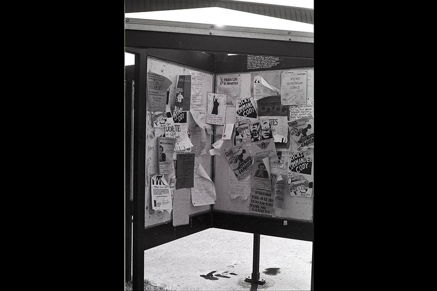 Early social media - a kiosk on campus filled with posters, events and advertisement - ca. 1986