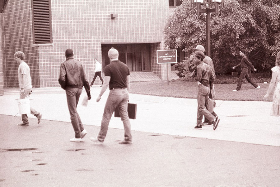 Students and staff walk towards the Gannon Building - ca. 1980s