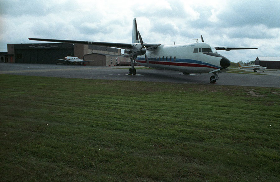 The Lansing Community College plane parked outside the LCC Aviation Technology Center hanger - ca. 1980s