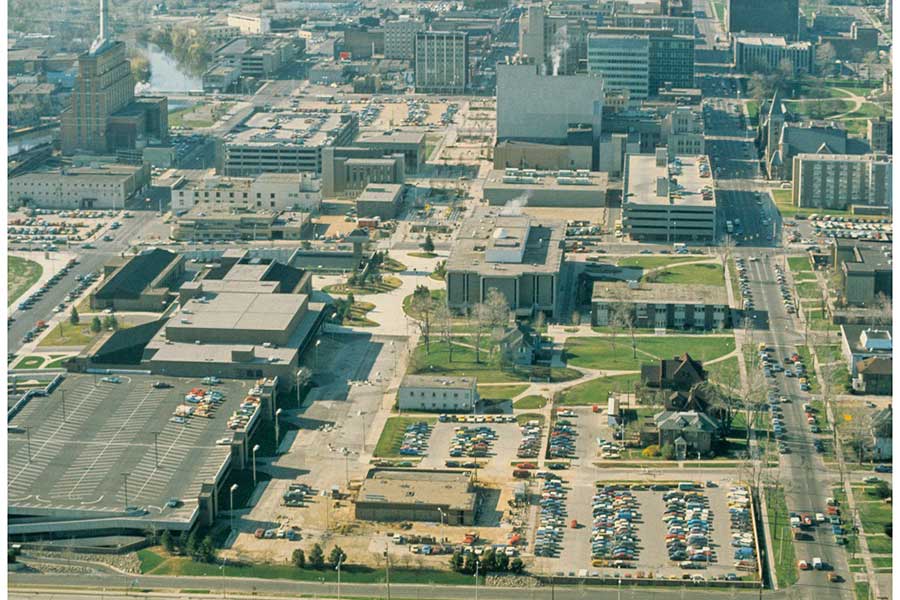 Aerial view of LCC's downtown campus, looking south. The campus is in the bottom half of the image with Grand Avenue on the left and Capitol Avenue on the right - ca. 1976-1979