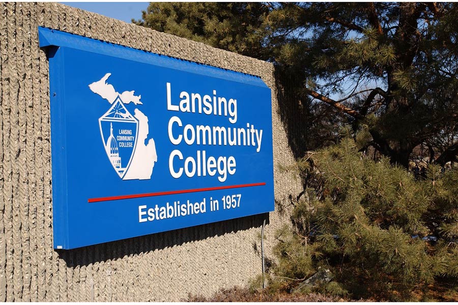 An updated Lansing Community College Sign at the corner of Shiawassee Street and Grand Avenue includes lighting and the college's logo - February 2003.