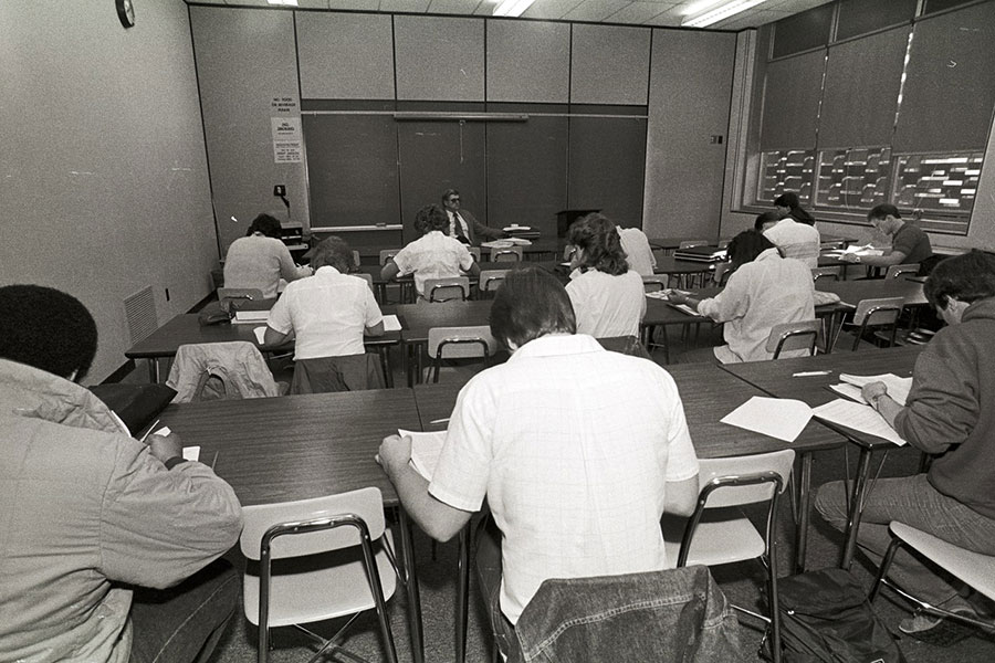 Taking a test in a classroom in Old Central - ca. 1980s