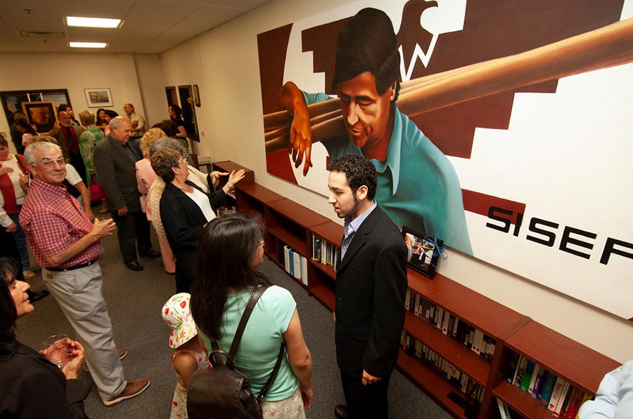 The Cesar Chavez mural dedication event on May 26, 2006. This mural hung in the Gannon Building in the room that was the Board Room when the Gannon Building first opened and is the current location of the Public Safety Office. The mural was later moved to the Cesar Chavez Learning Center on the third floor of the building. It hung there until the summer of 2021 when it moved with the Cesar Chavez Learning Center to it's new location in the Arts & Sciences Building.