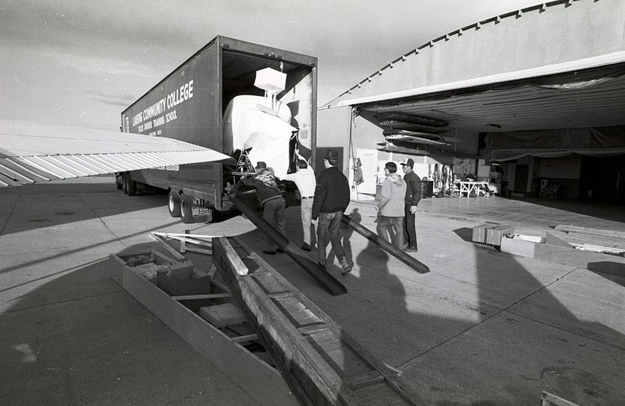 A truck from the LCC Truck Driver Training School was used to transport an airplane from Grand Rapids to a hanger at LCC's Aviation Technology Center in Mason - ca. 1980s