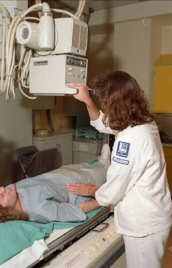 A Radiologic Technology Student from the LCC Department of Health Careers preps a patient for an x-ray - May 1988