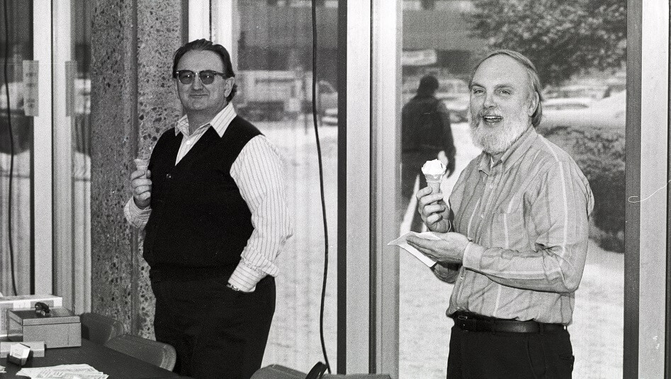 Bill Petry (right) and another staff member enjoy ice cream at an event in the Arts and Sciences building - ca. 1988