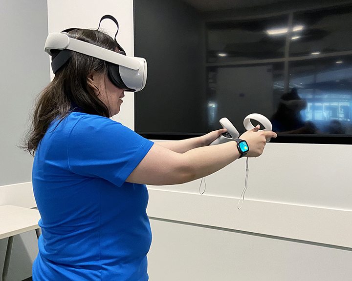 a student using the oculus headset in the VR room