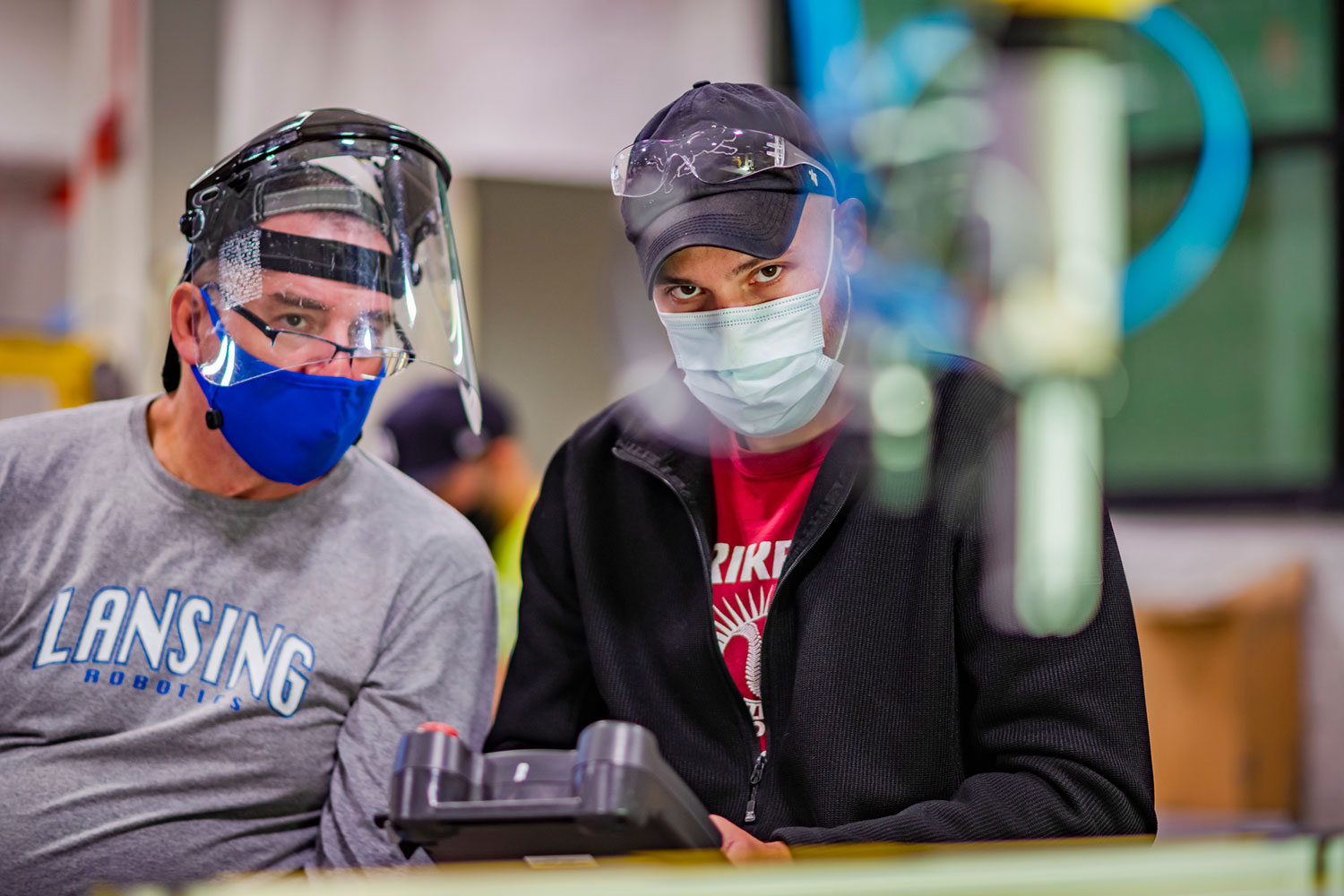 robotics student and instructor with masks on