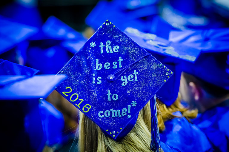 Blue graduation cap reading "the best is yet to come"